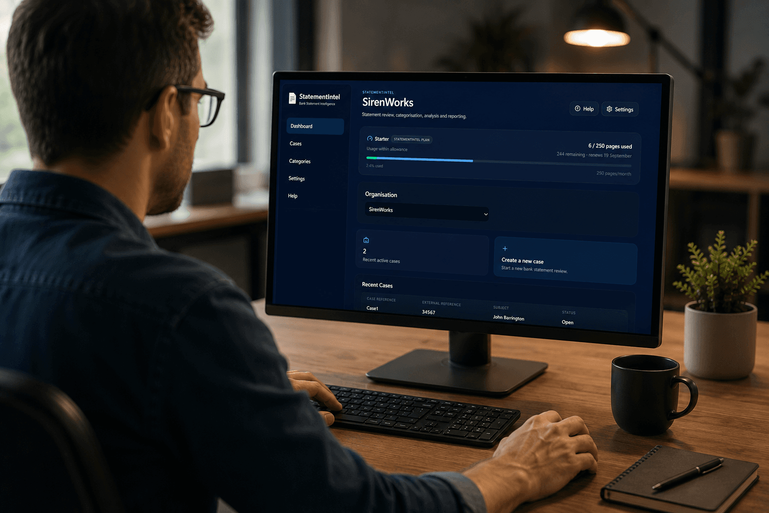 Finance professional using StatementIntel bank statement analysis software on a desktop computer